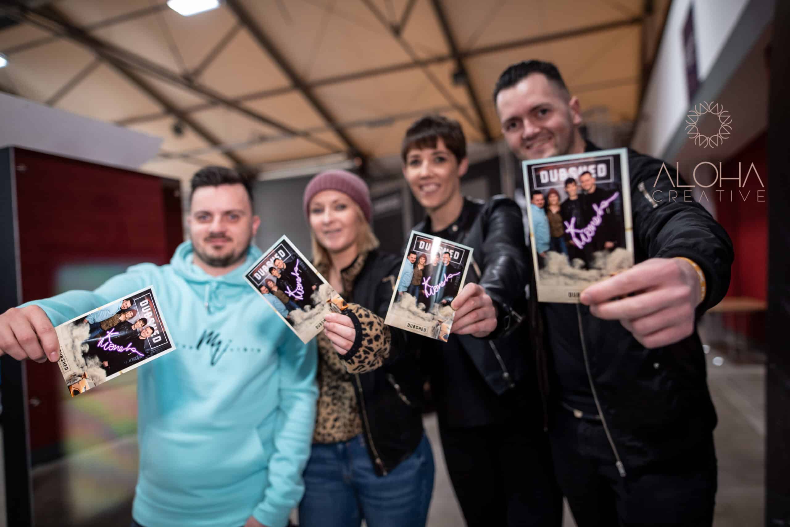 Large expo venue with multiple brand booths and displays