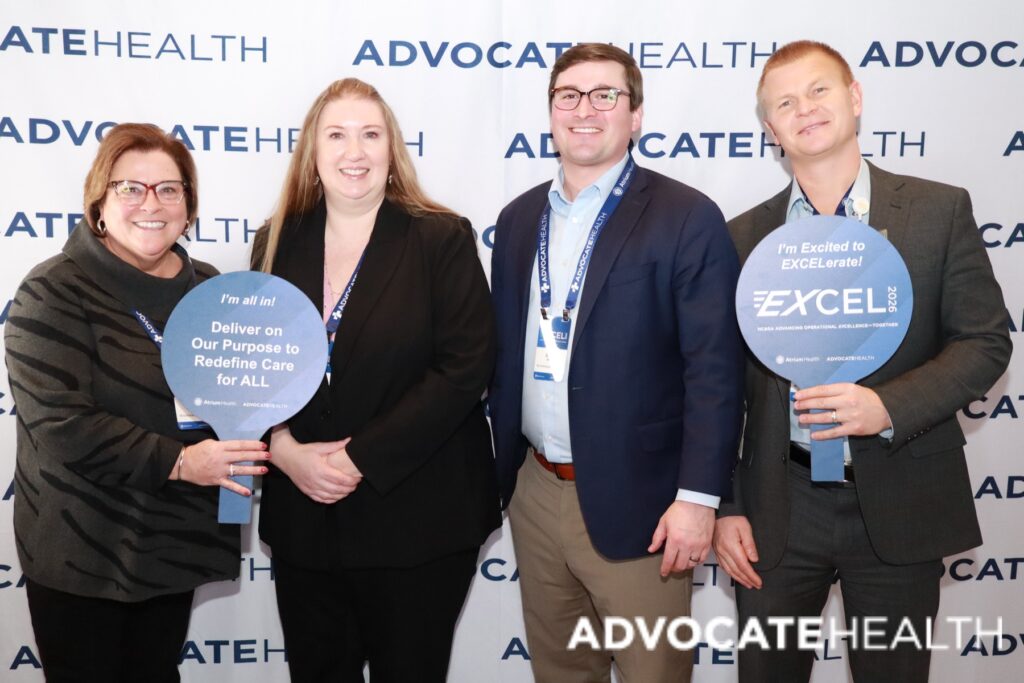 Advocate Health team members posing at a branded corporate photo booth activation in Charlotte, NC