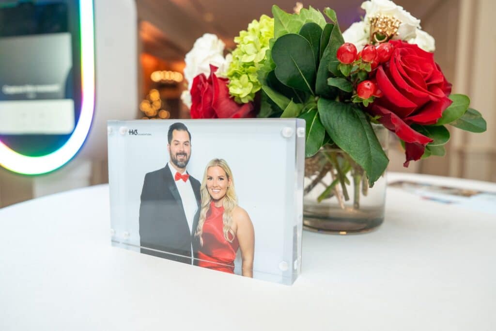 Custom glam photo booth keepsake print displayed at an event in myers park, Charlotte, NC