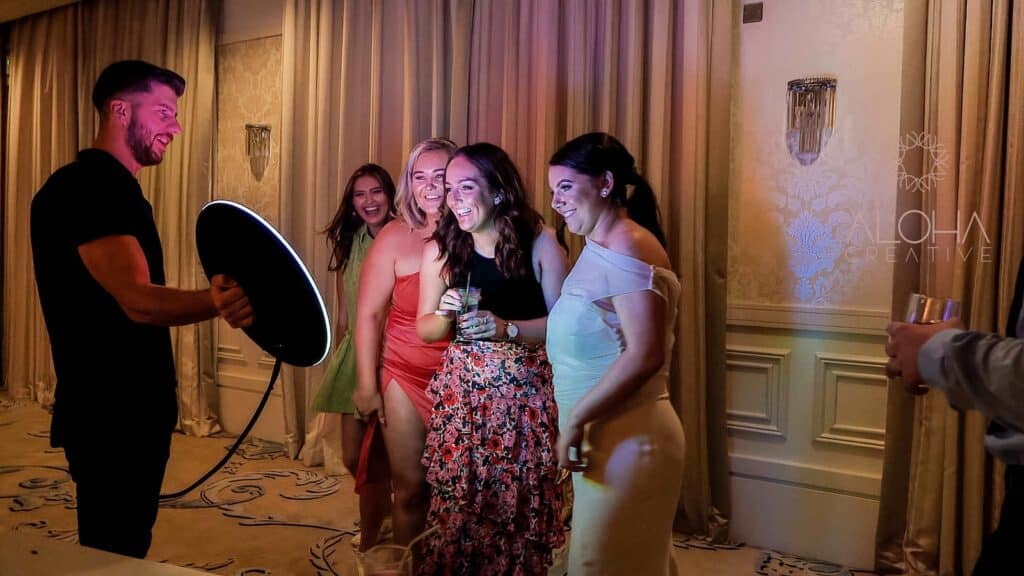 Guests posing with a roaming photo booth at a live event in Charlotte, NC