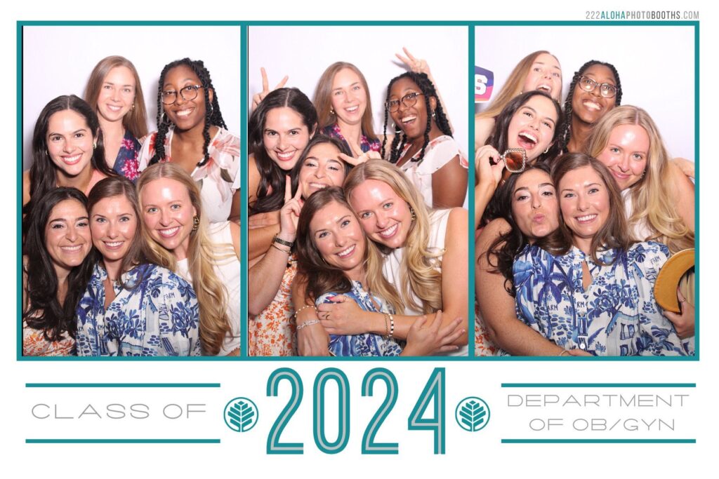 Group of smiling women posing in a photo booth, celebrating the Class of 2024, with "CLASS OF 2024" and "DEPARTMENT OF OB/GYN" text displayed, showcasing a joyful moment at a graduation event in Charlotte.