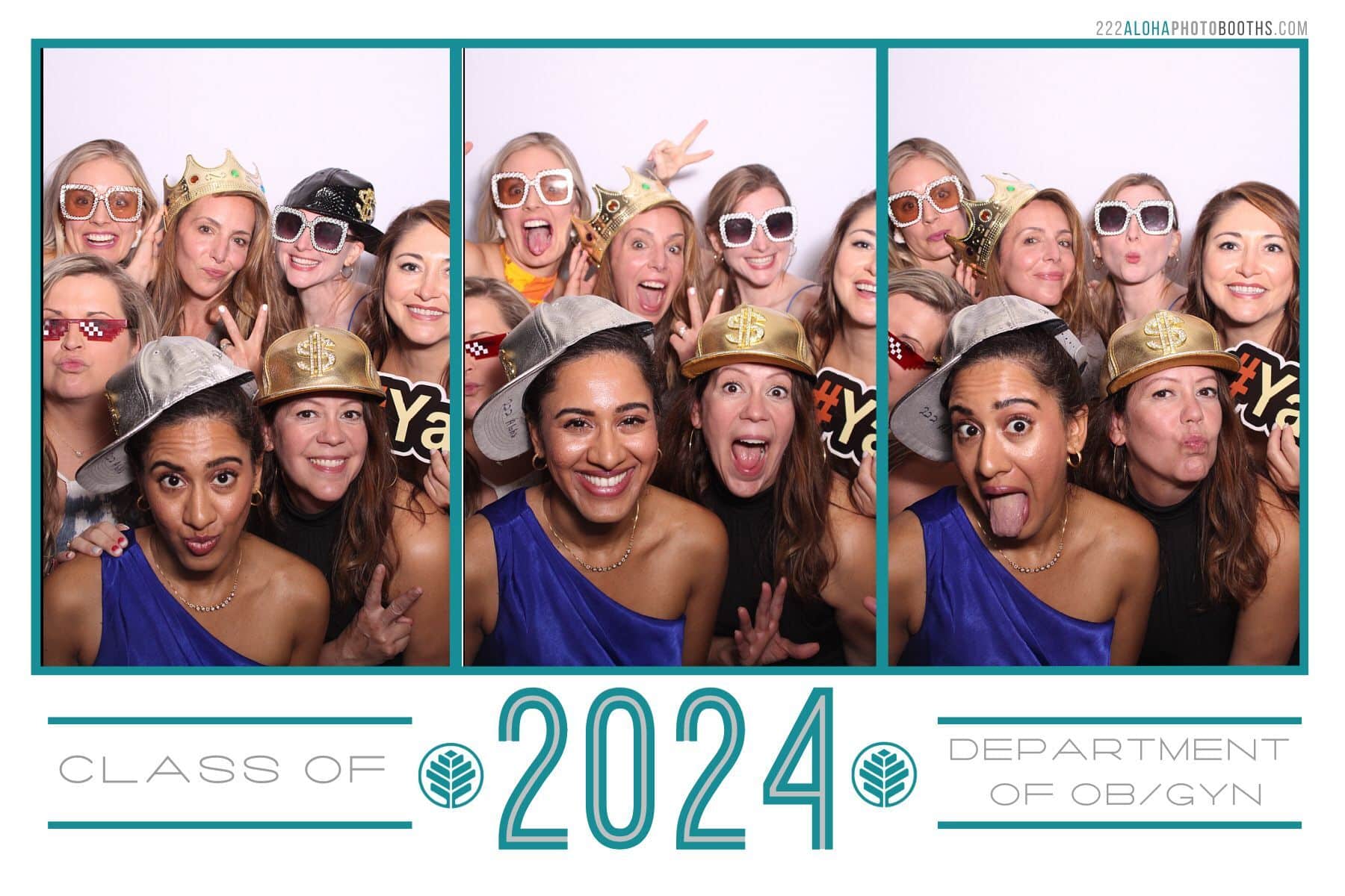 Group of graduates celebrating with props in interactive photo booth, featuring "Class of 2024" and "Department of OB/GYN" text, capturing joyful moments at a Charlotte event.