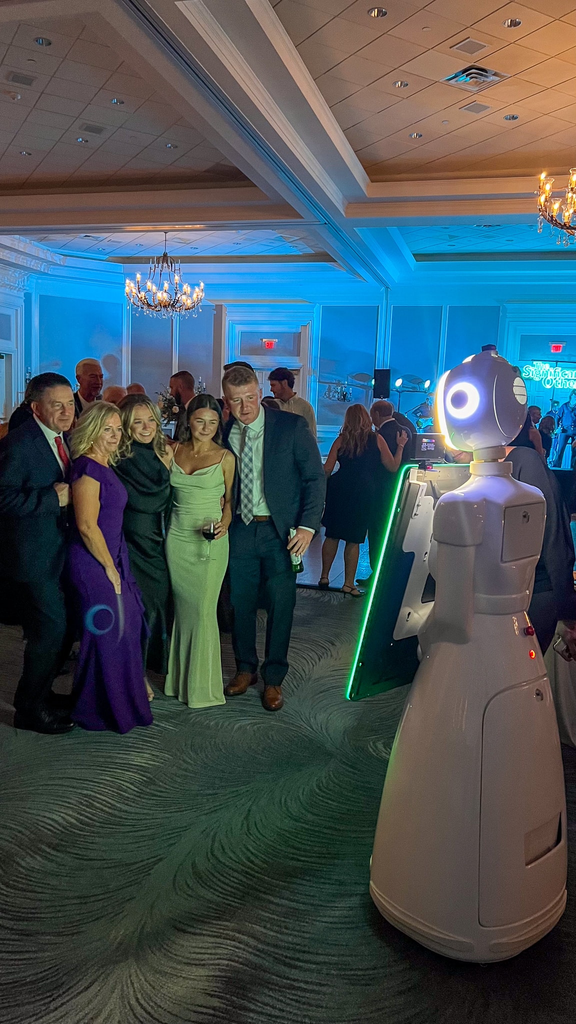 Ballantyne photo booth rental at a luxury Charlotte NC event with Rosie the AI Robot and formally-dressed guests