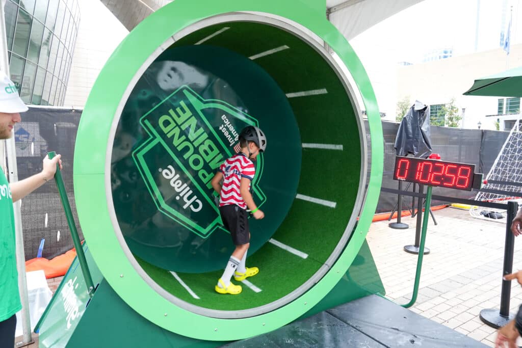 event photography brand shoot at the nascar hall of fame charlotte nc. Soccer event for kids with a mvp FIFA champion.