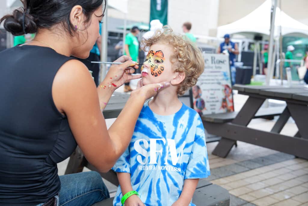 Attendees taking part in an outdoor brand activation at the NASCAR Hall of Fame in Charlotte, NC