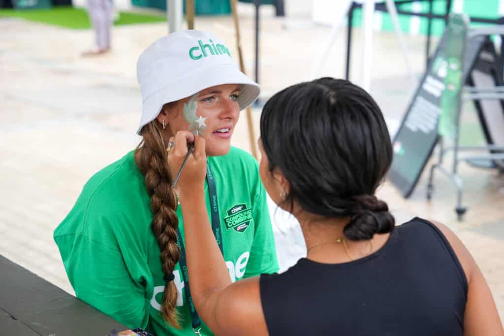Guest engaging with a hands-on branded installation at a Charlotte brand activation