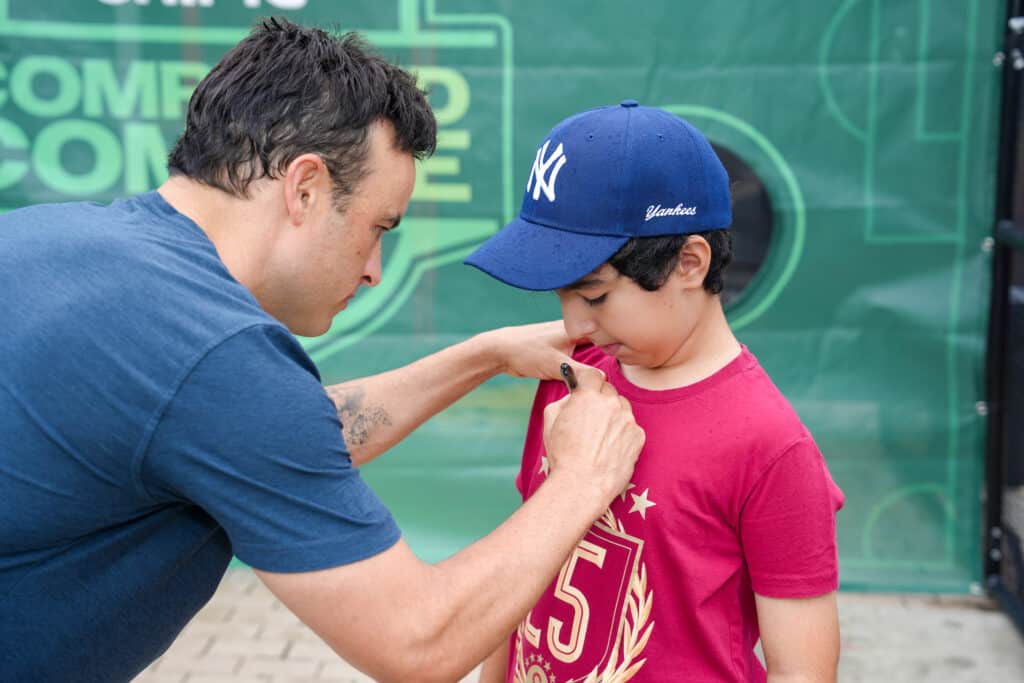 Guest at a hands-on activity station during a brand activation at the NASCAR Hall of Fame in Charlotte