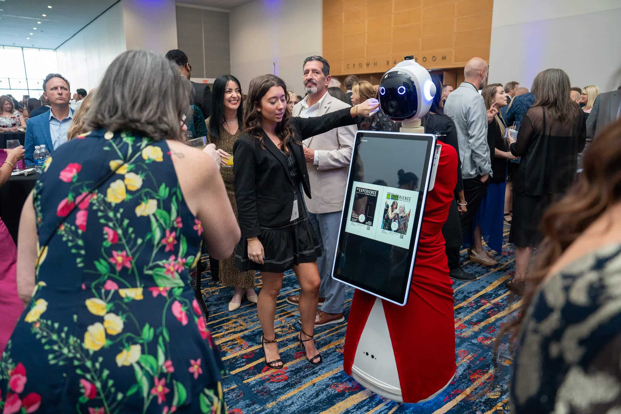 Rosie the AI robot at the charlotte nc. Guest are lined up taking photo