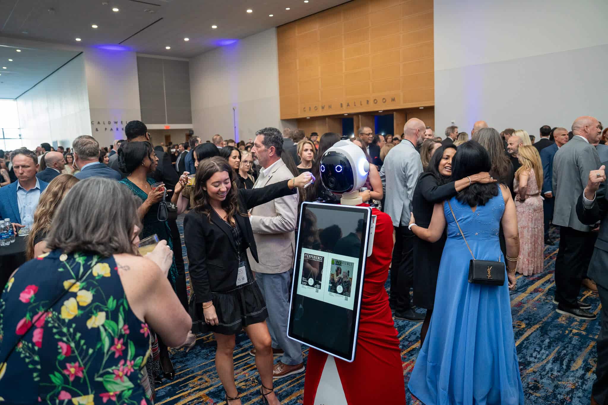 Rosie the Ai Photo Booth Robot is engaging with guest using ai technology at the nascar hall of fame 2026 HTA gala.