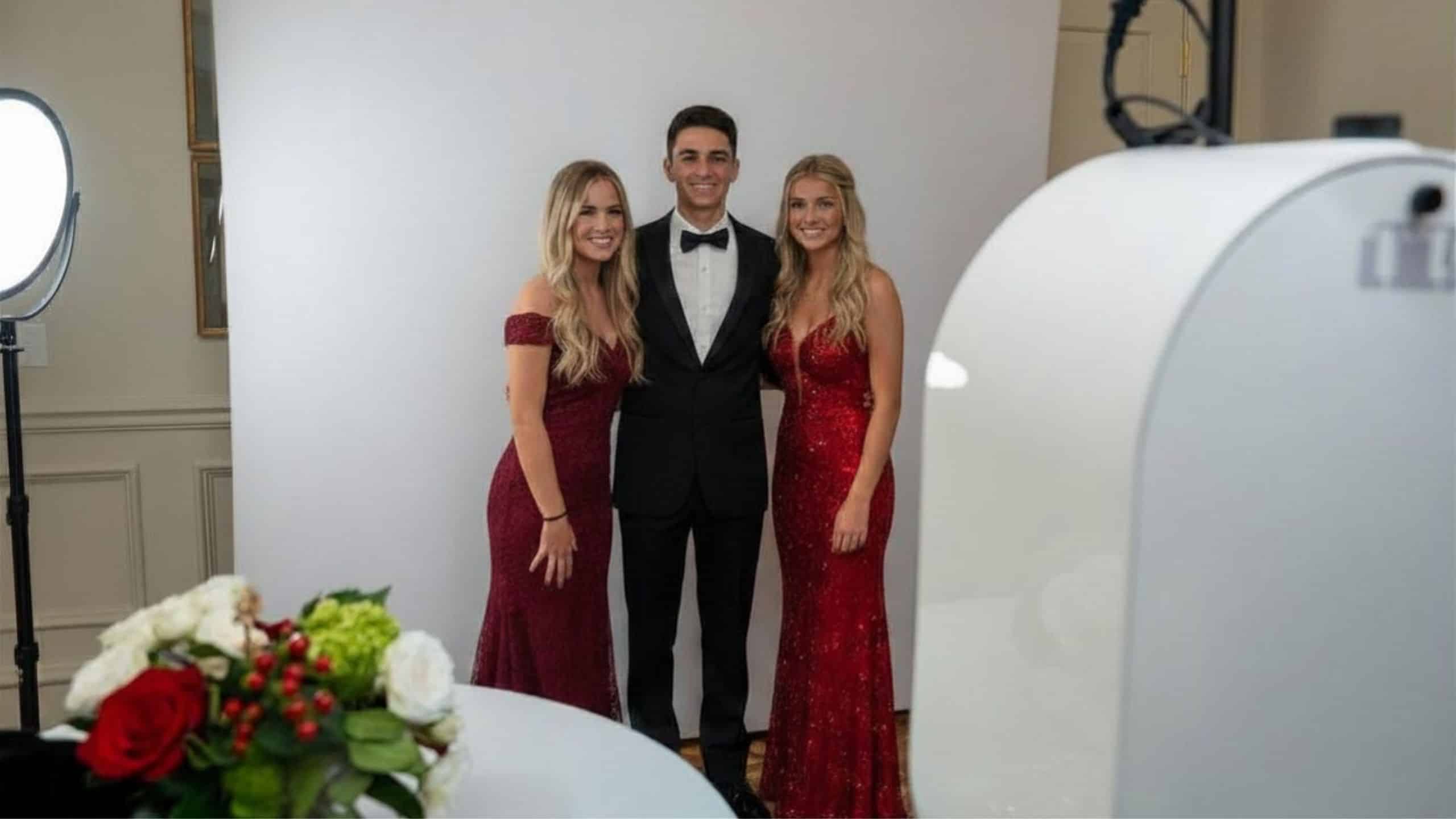 Lancaster SC prom photo booth - high school students in formal attire posing at Aloha Creative branded backdrop and 360 booth setup